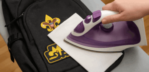 ironing patch onto backpack